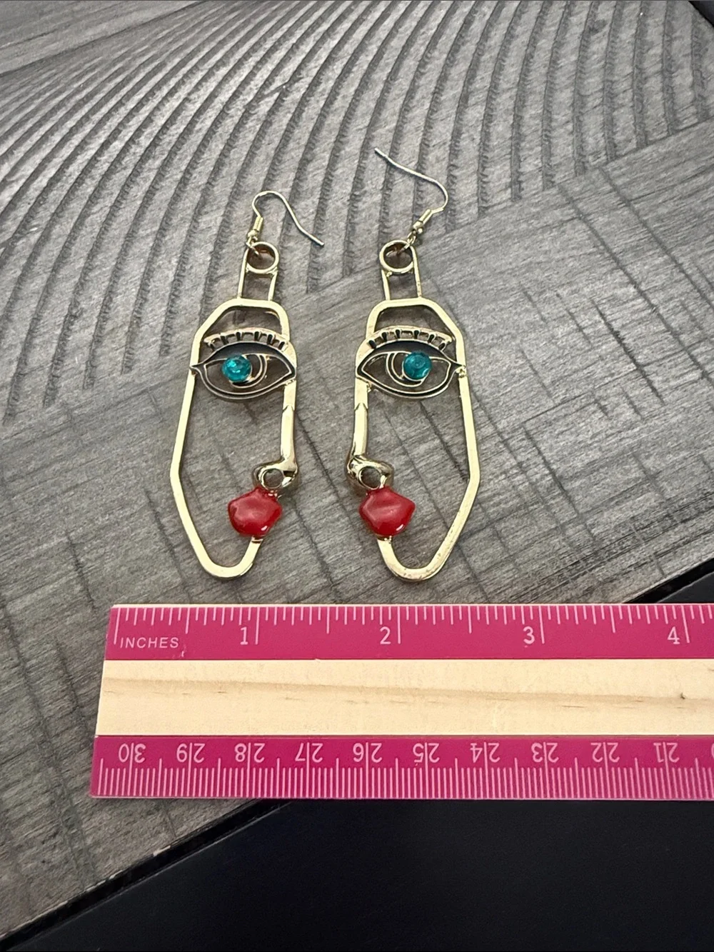 Gold Face Outline Drop Earrings with Blue and Red Accents